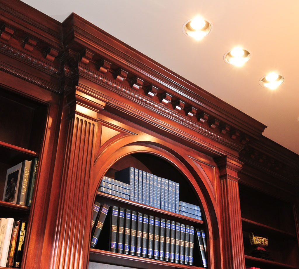 Built in Walnut bookcase with dentil moulding and pilasters