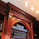 Built in Walnut bookcase with dentil moulding and pilasters