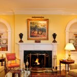 Concave shell niche bookshelves and Federal style fireplace with massive crown cove molding